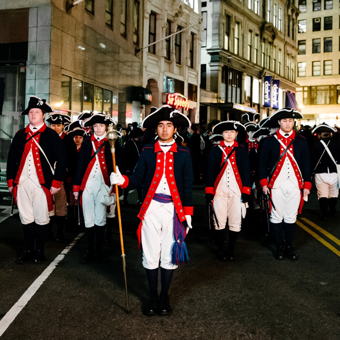 boston tea party reenactment marching to dump the tea